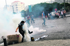 Supporters of the March 14th anti-Syrian opposition coalition face off with Lebanese police on Sunday. Protesters tried to storm the Government Palace after funeral of top intelligence chief General Wissam al-Hassan in Beirut. Police fired in the air and used teargas. Hassan, a prominent Lebanese figure opposed to Syrian President, died in a bomb explosion on October 19.