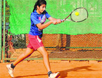 Preet Nain plays a shot during the British Total Tennis Tournament, Sector 70, in Mohali on Monday. Tribune photo: Vicky Gharu