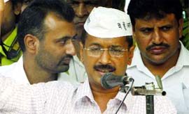 The India Against Corruption activist Arvind Kejriwal addresses a public meeting outside of the BSES office in East Delhi on Monday.