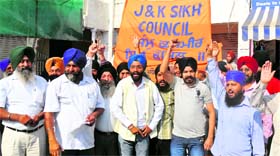 Members of the J&K Sikh Council protest at Nanak Nagar in Jammu on Monday.
