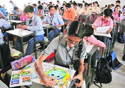 Students participate in a painting compitition at Government Higher Secondary School (Boys), Gandhi Nagar, Jammu, on Monday.