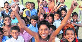 The winning kabaddi team and their supportes rejoice.