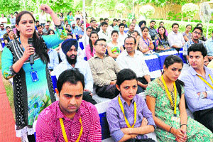 A woman asks a question during the interactive session with DLF employees at IT Park in Chandigarh on Tuesday.