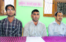 President of the Inqualabi Mazdoor Kendra Kailash Bhatt (right) addresses a press conference in Dehradun on Tuesday. 