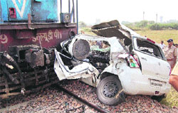 The damaged Maruti car after its accident with a train at an unmanned railway crossing near Jassia village in Rohtak district on Tuesday. Photo: Manoj Dhaka