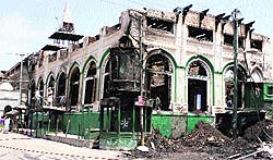 A file photo of the gutted Dastgeer Sahib shrine at Khanyar