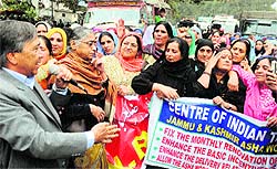Members of the Jammu and Kashmir Anganwadi workers led by CPM leader M Y Tarigami hold a protest rally over their long-pending demands in Srinagar on Tuesday