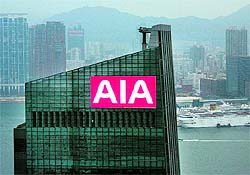 A billboard at the top of AIA Central, previously AIG Tower, flashes the company sign at Hong Kong's financial Central district. As well as firing thousands of staff, investment banks in Asia are quietly culling clients, too. The region's initial public offering boom has slowed  the US $20 billion mega-IPOs by Agricultural Bank of China and insurer AIA Group Ltd are now, in 2012, more than two years ago  and the banks' business model needs a refresh. Banks resisted making cuts in the wake of the crisis and as IPO fees began to recede. Now, with few deals and thin fee streams, investment banks in Asia are wielding the axe
