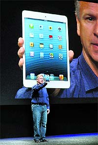 Apple senior vice-president of worldwide product marketing Phil Schiller announces the new iPad Mini during a special event at the historic California Theatre in San Jose, California. Apple introduced the new iPad mini 7.9-inch version of the iPad tablet at $329