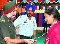 Additional Director General, NCC, Maj Gen PS Mander felicitating a cadet in Chandigarh