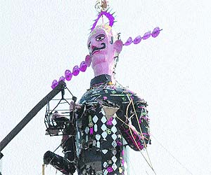 An effigy damaged due to previous night's rain being repaired at Sector 46 in Chandigarh on Wednesday