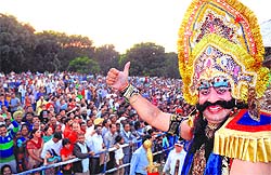 An actor in the getup of Ravana at the Parade Ground in Sector 17, Chandigarh; (below) members of a delegation from the United States of America at the Dasehra function in Sector 5, Panchkula