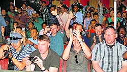 An actor in the getup of Ravana at the Parade Ground in Sector 17, Chandigarh; (below) members of a delegation from the United States of America at the Dasehra function in Sector 5, Panchkula