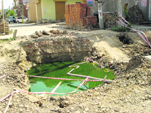 The entry to a colony is cut off from the main road as a pit filled with stinking water has been formed around a manhole on the Ambala road in Kaithal.