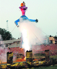 People burn an effigy of Ravana at Vishkarma School near Jhajjar Chungi in Rohtak district on Dasehra.