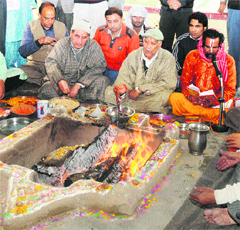 A non-local pujari performs a hawan during the recent Navaratra festival at a temple in Srinagar.