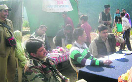 Participants alongwith Army officials at a medical camp in Doda on Tuesday.
