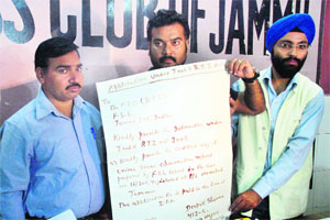 Deepak Sharma shows the application written with blood in Jammu on Wednesday. 