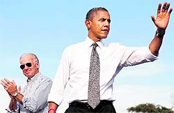 US President Barack Obama and Vice-President Joe Biden acknowledge supporters during a campaign rally in Ohio; and (right) Republican presidential nominee Mitt Romney (R) and vice-presidential nominee Paul Ryan wave at the conclusion of a campaign rally in Nevada