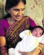 Satyavathi Venna holding her granddaughter Saanvi Venna