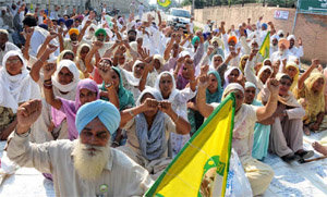 Activists of the BKU (Ekta Ugrahan) stage protest outside the office of the Chief Agriculture Officer in Bathinda demanding a check on the sale of spurious seeds in the market. 