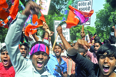 Activists of the BJP shout slogans during a demonstration at Jantar Mantar against Chief Minister Sheila Dikshit and Defence Minister A.K. Antony against the sealing and demolition drive in Delhi Cantonment on Thursday. 
