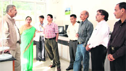 Director, Forest Research Institute, Dr PP Bhojvaid, intereacts with scientists at the newly set up molecular physiology and biochemistry laboratory in Dehradun on Thursday. A Tribune photograph