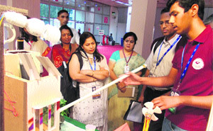 Deepankar, a class XI student of Model School, Sector 4, Rohtak, explains his project to judges at the 2nd state-level exhibition organised by the Department of Science and Technology in Delhi on Thursday. 