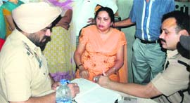 Police records the statements of residents after the firing incident at the Central Town locality in Jalandhar.