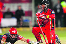 Lions Thami Tsolekile tries to run out Kevin Pietersen during the first semifinal on Thursday. 