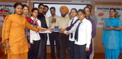 Students receive certificates at the Zeal 2012 held at the BFGI on Friday. Tribune photo
