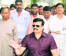 Chairman of the Forest Corporation and MLA Kunwar Pranav Singh Champion at a meeting with farmers at Khanpur on Friday.