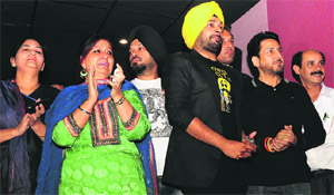 Savita Bhatti and Jasraj Bhatti (right), son of Jaspal Bhatti, during the premiere of Power Cut at a Chandigarh theatre on Friday