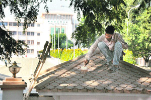 A painter at work in the civil secretariat complex in Jammu.