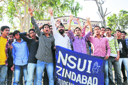 NSUI leaders stage a protest at Jammu University on Friday. Tribune photo: inderjeet SIngh