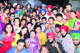 A team of the APJ College of Fine Arts poses for a photograph after winning the overall championship trophy of the Inter-Zonal Youth Festival held at Guru Nanak Dev University.