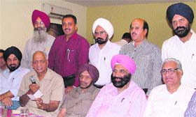 Joginder Kumar, former CEO of LETS, addresses mediapersons in Ludhiana on Friday. 
