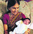 In this undated photo provided by police, Satyavathi Venna holds her granddaughter Saanvi. 