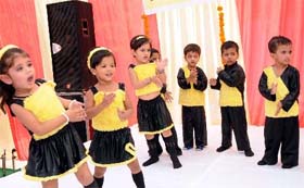Tiny tots at the Kids Care playway school perform at a function held on Saturday.