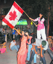 Students perform bhangra outside Pal Dhaba in Sector 28 on Saturday.