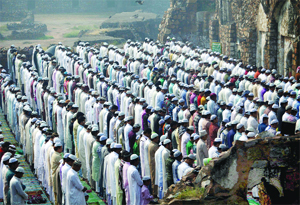  Muslims gather to offer their prayers on the occasion of Eid-ul-Zuha in the ruins of the Feroz Shah Kotla mosque in New Delhi on Saturday. 