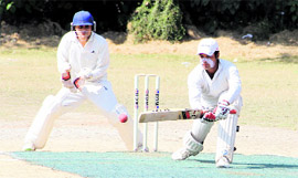 A batsman in action during a match in the Youth Cup Cricket Tournament in Dehradun.