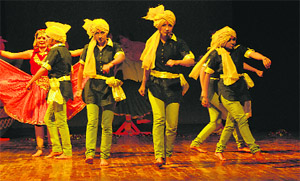 Artistes present a Haryanvi pop song at, Ratnawali--2012, in the Kurukshetra University auditorium on Saturday.