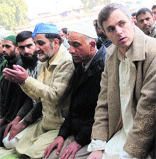 Chief Minister Omar Abdullah along with others offers Eid prayers at Hazratbal shrine in Srinagar on Saturday. 