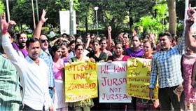 Scholars stage protest at University of Jammu on Saturday.