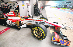 HRTs Narain Karthikeyan comes out of the paddock.  AFP