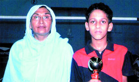 Shuttler Rhitvik Mohanty (right) along with his coach Sakuran Begum who is herself a former national player.