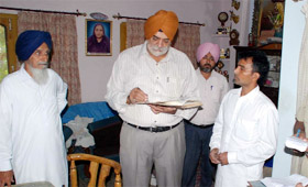 Policemen take stock at the house of the doctor that was burgled on 100-feet road on Sunday.