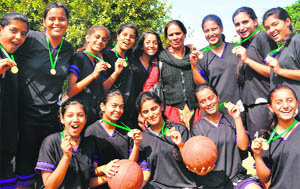Basketball players of Sacred Heart School, Sector 26, pose after winning the Inter-School Basketball Tournament.