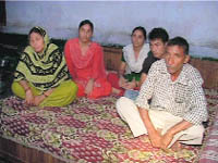 A family putting up in a nearby school at Chandi Kotla. 